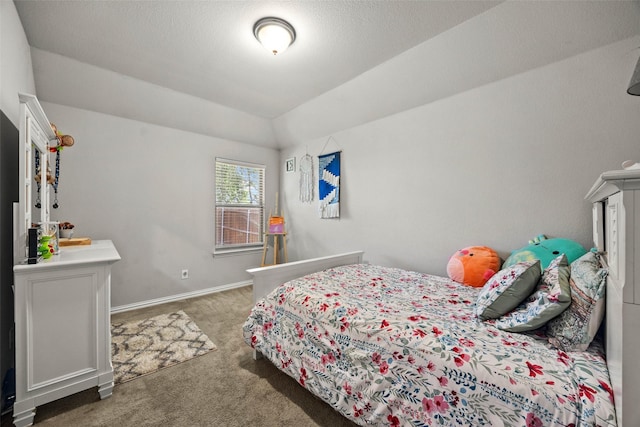 bedroom featuring carpet and vaulted ceiling