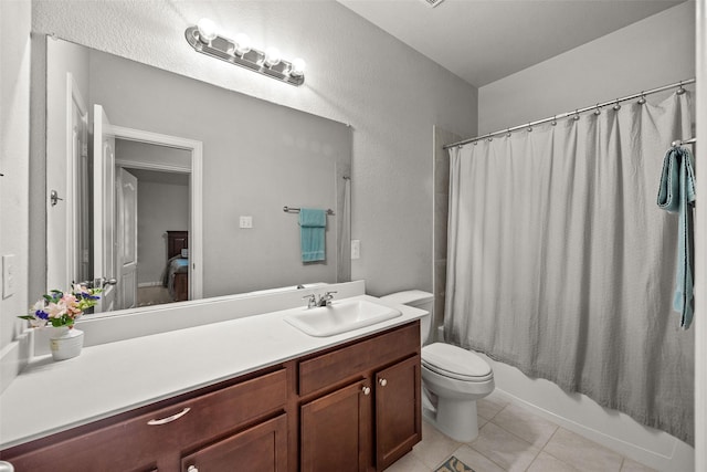 full bathroom with tile patterned floors, vanity, toilet, and shower / bathtub combination with curtain