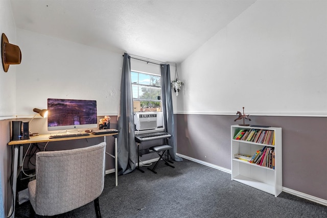 office area featuring cooling unit, lofted ceiling, and dark carpet