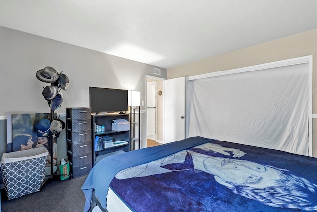 bedroom with dark carpet