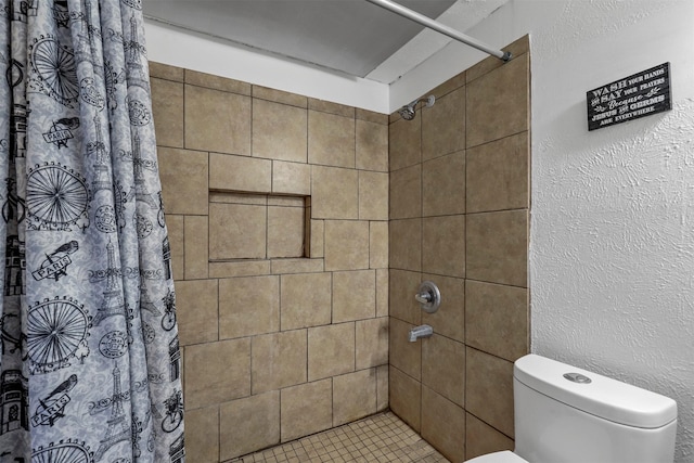 bathroom featuring toilet and a shower with shower curtain