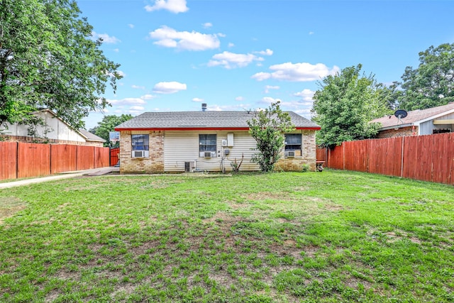 back of house featuring a yard