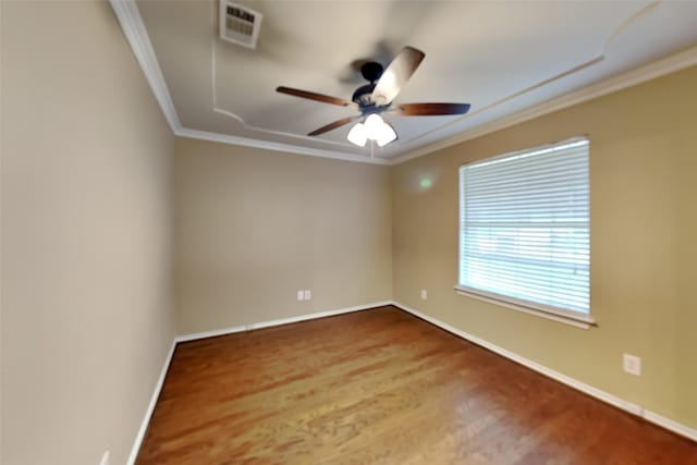 empty room featuring wood-type flooring, ceiling fan, and crown molding