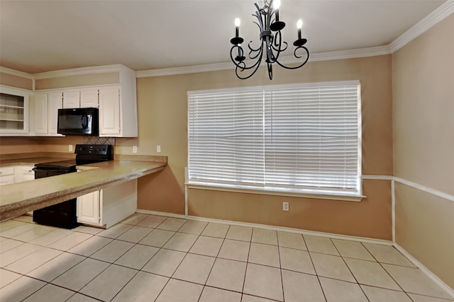 kitchen with black appliances, white cabinets, light tile flooring, and a notable chandelier