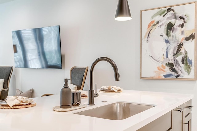 interior details with sink and hanging light fixtures