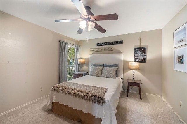 bedroom featuring ceiling fan and light carpet