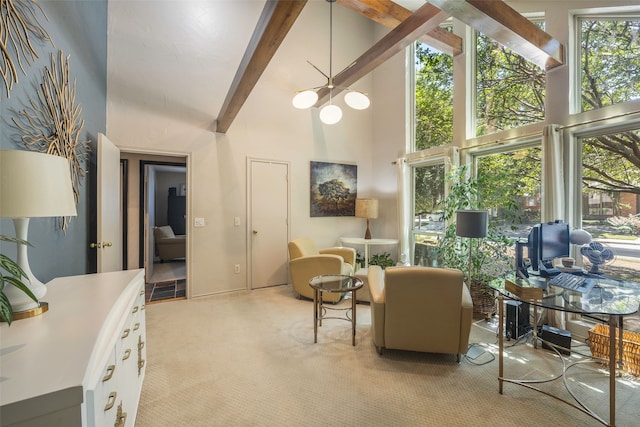 sitting room with beamed ceiling, light colored carpet, and high vaulted ceiling