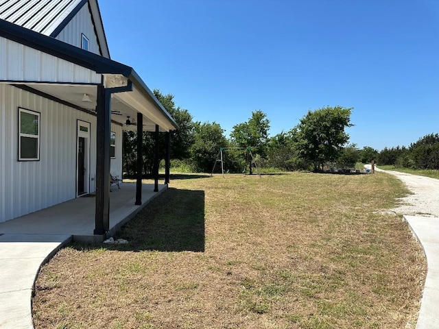 view of yard with a patio and a playground