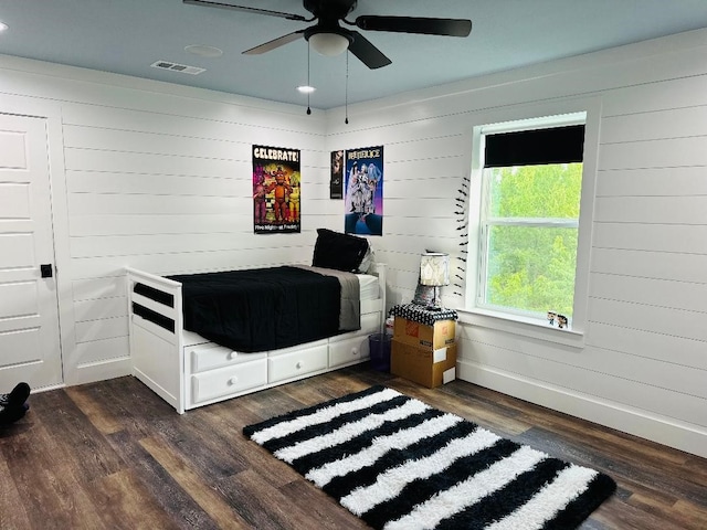 bedroom featuring dark hardwood / wood-style flooring and ceiling fan