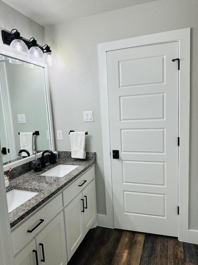 bathroom featuring vanity and hardwood / wood-style floors