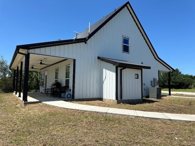 back of house with a patio, a yard, ceiling fan, and central air condition unit