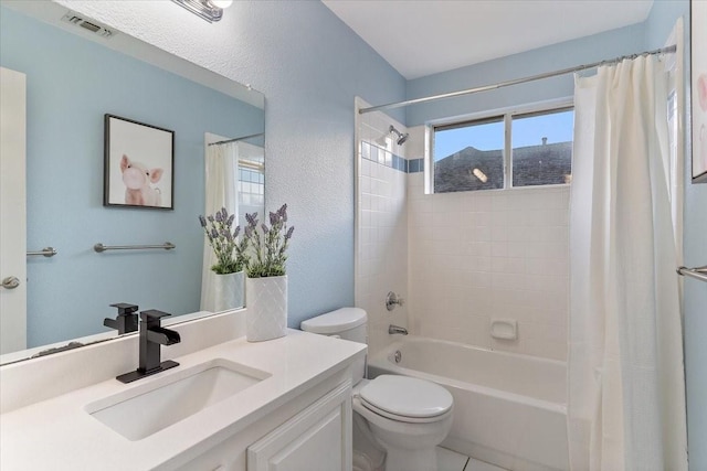 full bathroom featuring a textured wall, toilet, vanity, visible vents, and shower / bath combo with shower curtain