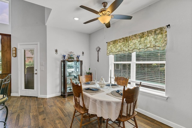 dining area with ceiling fan, plenty of natural light, and dark hardwood / wood-style flooring