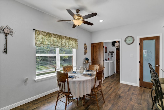 dining area featuring ceiling fan, dark hardwood / wood-style floors, and washer and clothes dryer