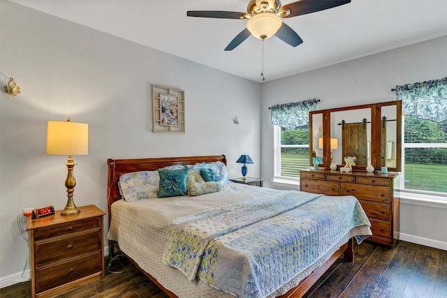 bedroom featuring ceiling fan and dark hardwood / wood-style floors