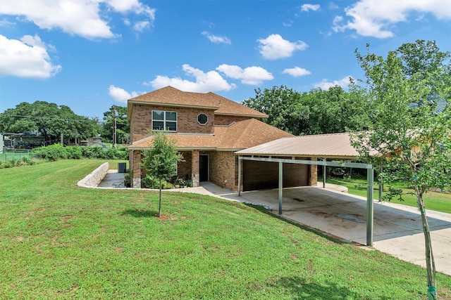 view of front facade with a garage, a front lawn, and a carport