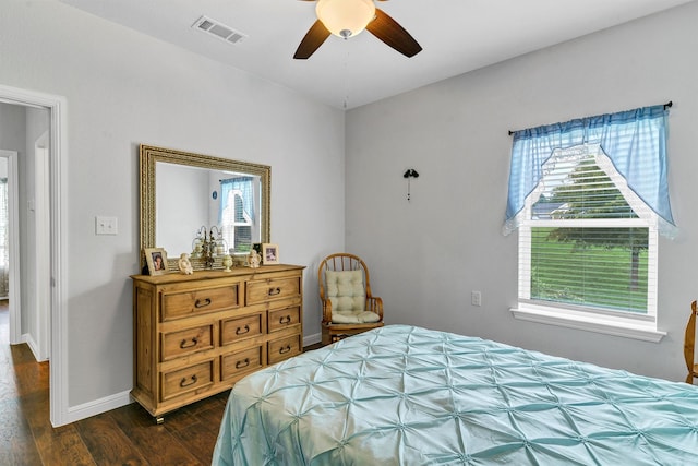 bedroom with ceiling fan and dark hardwood / wood-style flooring