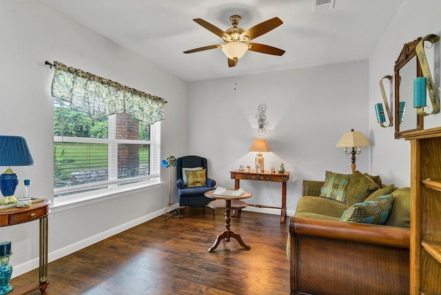 living room with ceiling fan and dark hardwood / wood-style floors