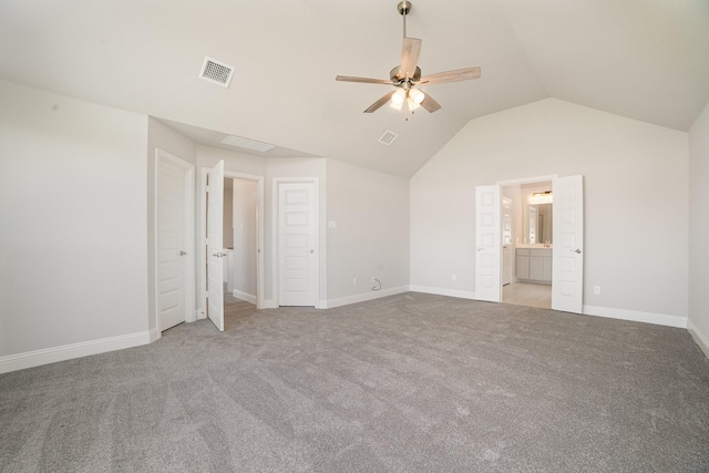 unfurnished bedroom with ceiling fan, lofted ceiling, ensuite bathroom, and carpet floors