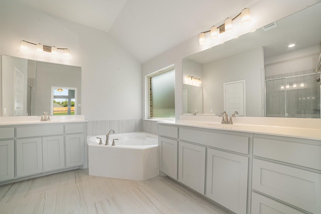 bathroom with vanity, plus walk in shower, and vaulted ceiling