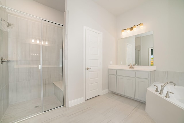 bathroom featuring vanity and separate shower and tub