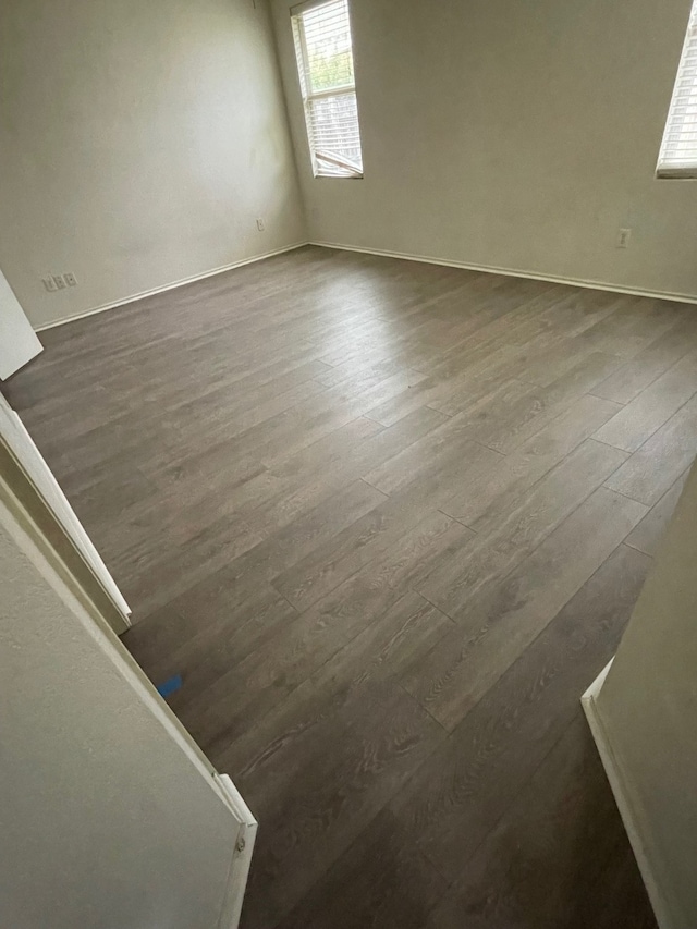 spare room featuring hardwood / wood-style floors