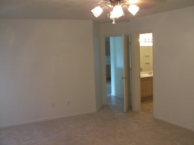 spare room featuring carpet floors and ceiling fan