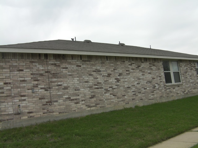 view of home's exterior with a lawn