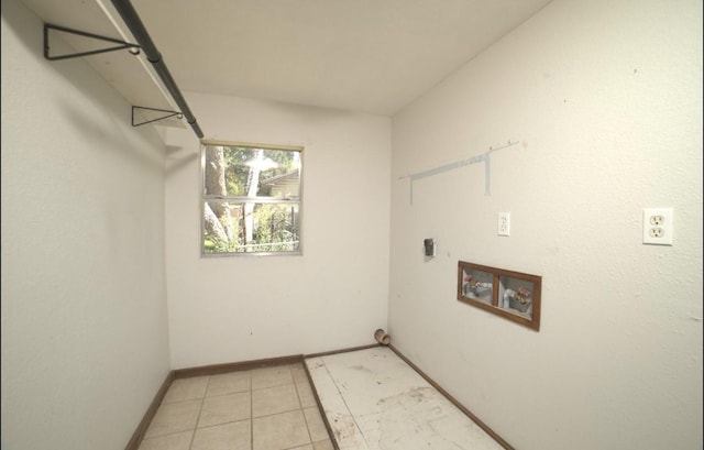 laundry room featuring hookup for a washing machine, light tile patterned floors, and electric dryer hookup