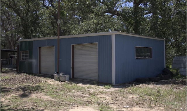 view of outbuilding with a garage