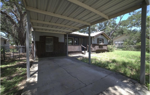 view of patio / terrace with covered porch and a carport