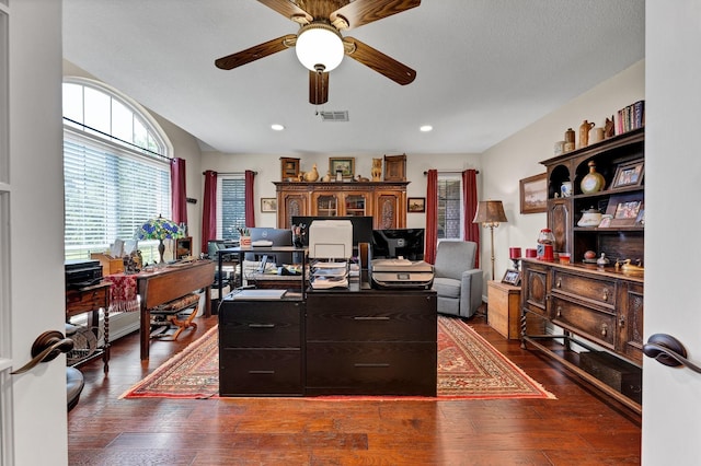 office with dark hardwood / wood-style floors and ceiling fan