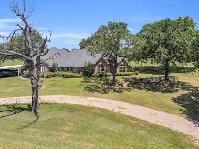 ranch-style house with a front lawn