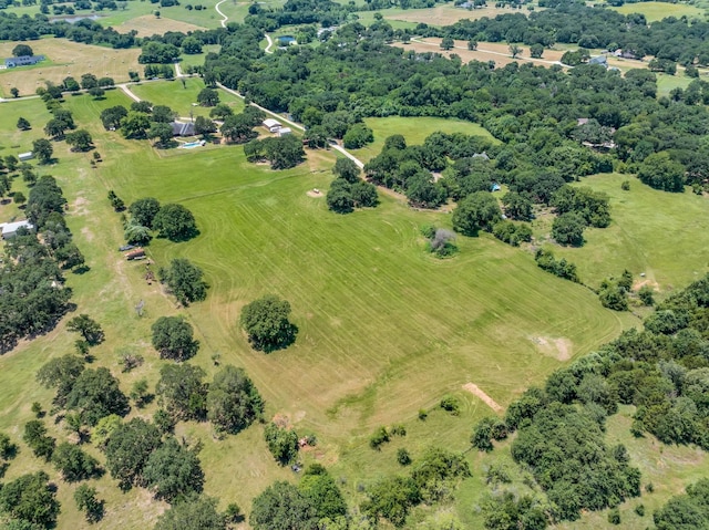 birds eye view of property with a rural view