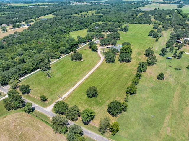 birds eye view of property with a rural view