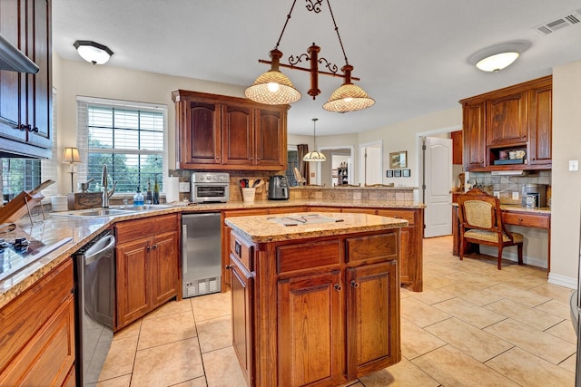 kitchen featuring decorative backsplash, sink, dishwasher, a center island, and hanging light fixtures