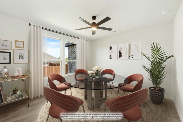 dining area featuring ceiling fan and hardwood / wood-style floors