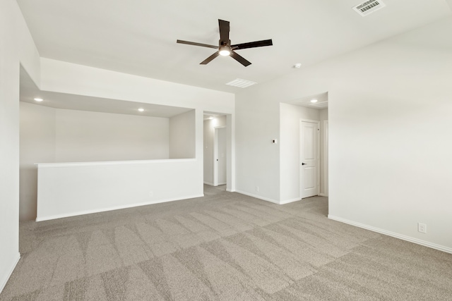 empty room featuring light colored carpet and ceiling fan