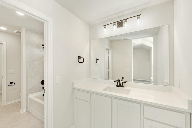 bathroom with tile patterned flooring, visible vents, vanity, baseboards, and shower / washtub combination