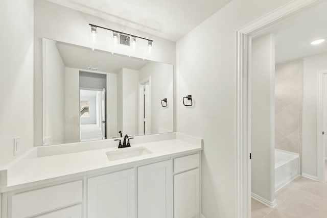 bathroom with tile patterned floors and vanity