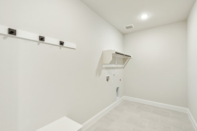 laundry room with washer hookup, hookup for an electric dryer, light tile patterned flooring, and hookup for a gas dryer