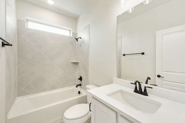 full bathroom featuring vanity, toilet, and tiled shower / bath combo