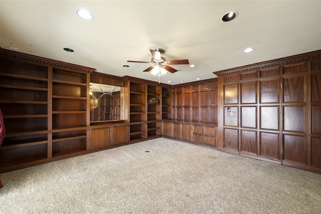 unfurnished living room with ceiling fan and light colored carpet