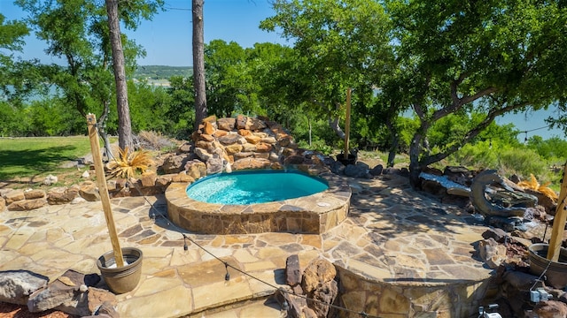 view of pool featuring a patio