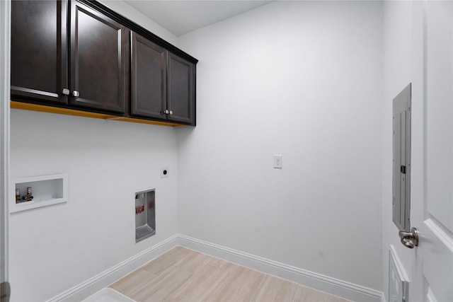 laundry room featuring cabinets, washer hookup, and electric dryer hookup