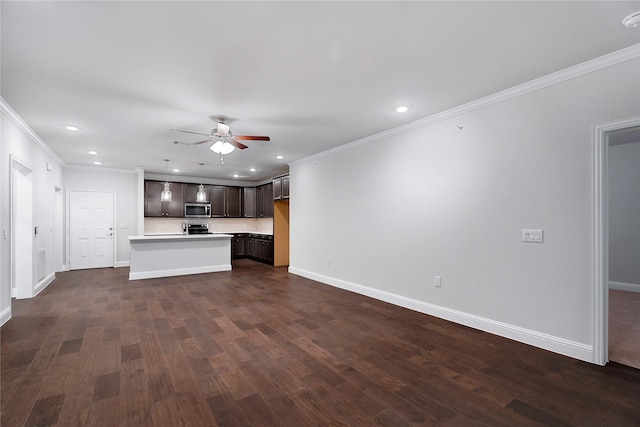 unfurnished living room with ceiling fan, ornamental molding, and dark hardwood / wood-style floors