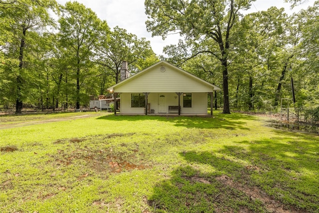 view of front facade featuring a front yard and a porch