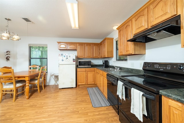 kitchen with a notable chandelier, black appliances, sink, light hardwood / wood-style flooring, and decorative light fixtures