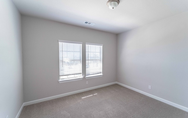 unfurnished room with plenty of natural light and carpet floors