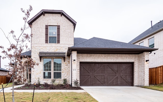 view of front of property with a garage